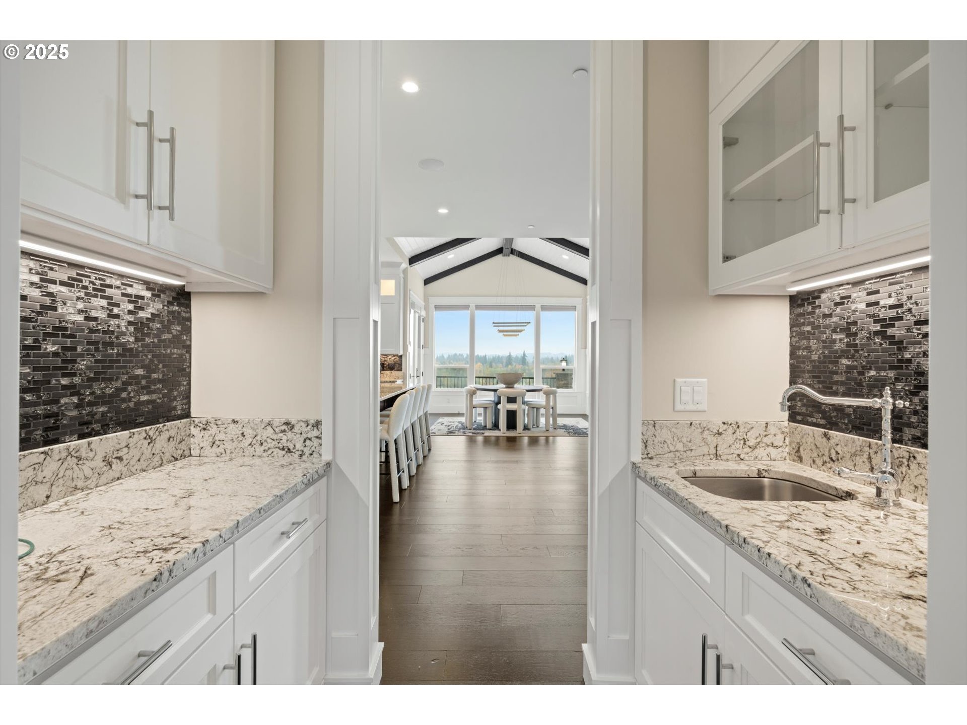 900 Northwest 216th Circle Ridgefield, WA 98642 - Photo 11 of 47 a kitchen with granite countertop a sink and cabinets