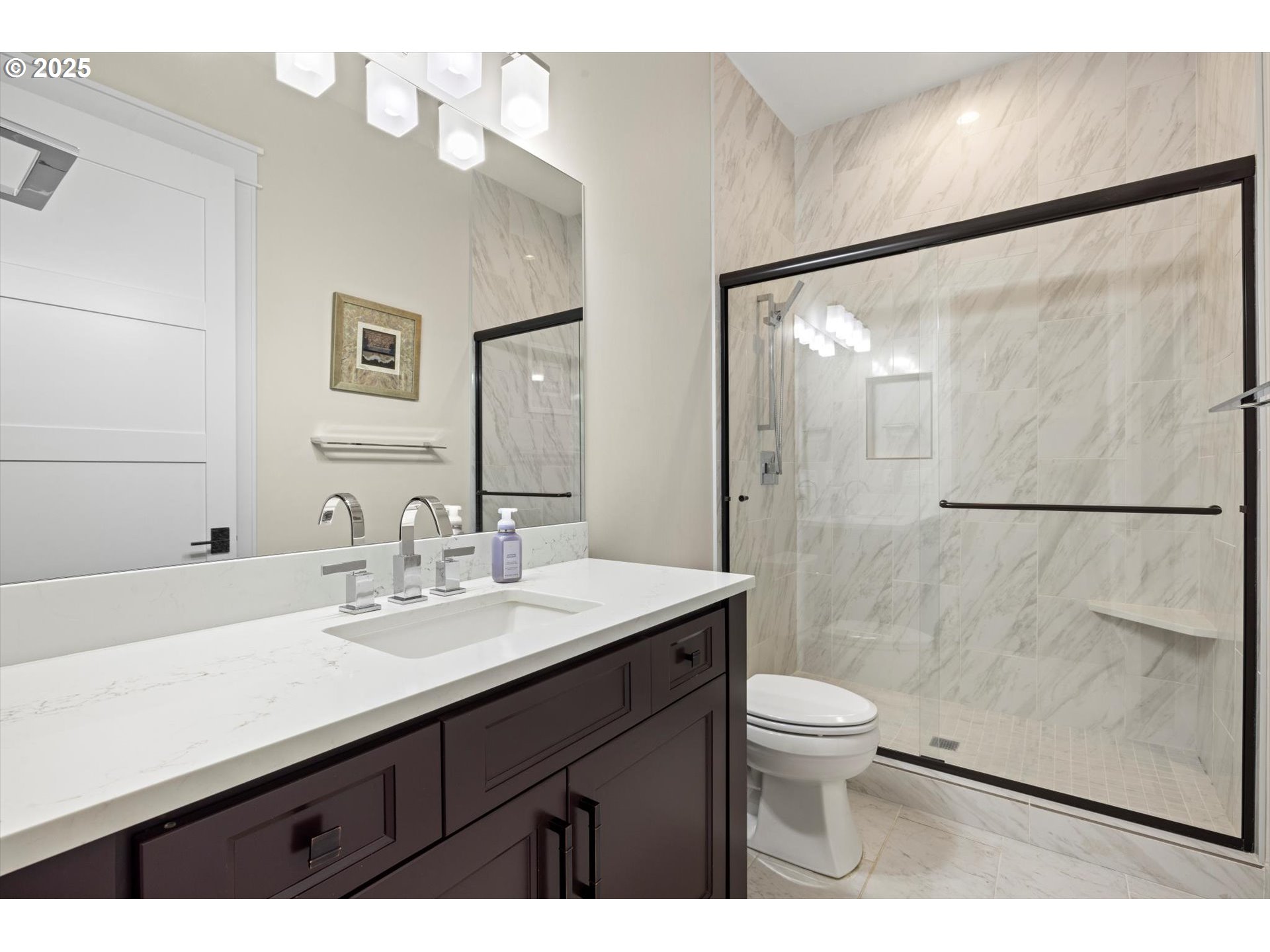 900 Northwest 216th Circle Ridgefield, WA 98642 - Photo 15 of 47 a bathroom with a sink a toilet a mirror and shower