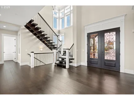 a view of an entryway with wooden floor