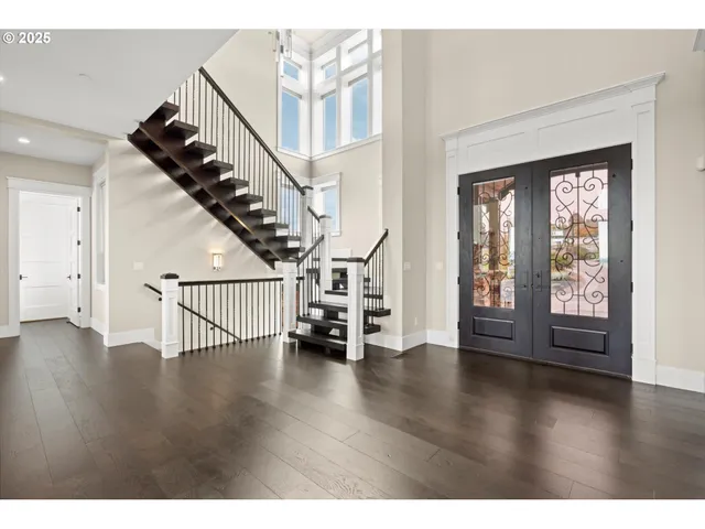 a view of an entryway with wooden floor