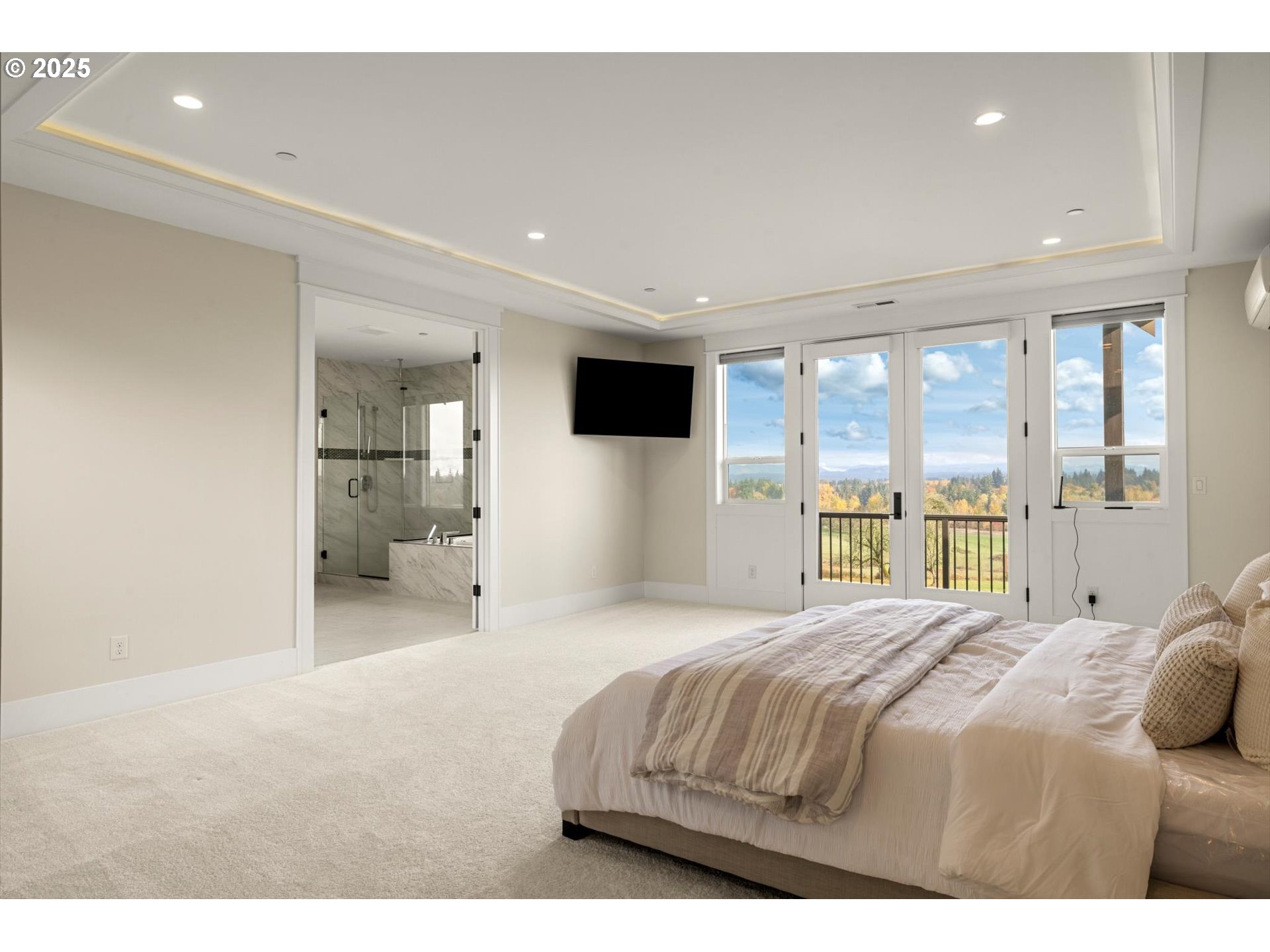 900 Northwest 216th Circle Ridgefield, WA 98642 - Photo 18 of 47 a bedroom with a bed and a large window