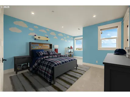 a spacious bedroom with a bed window and a dresser