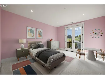 a living room with a bed furniture and a large window