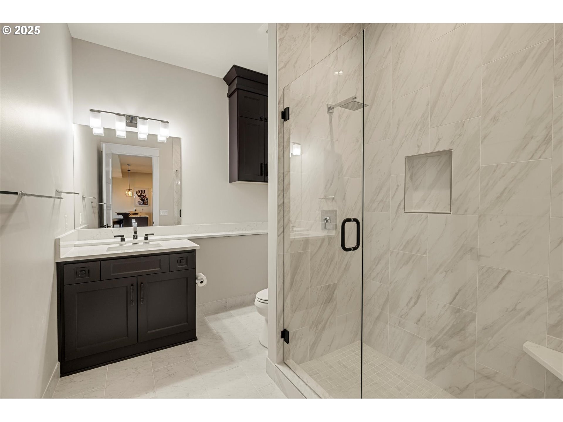 900 Northwest 216th Circle Ridgefield, WA 98642 - Photo 35 of 47 a bathroom with a sink a mirror a vanity and shower