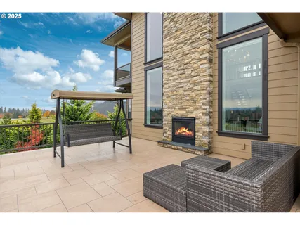 a living room with furniture a fireplace and a table