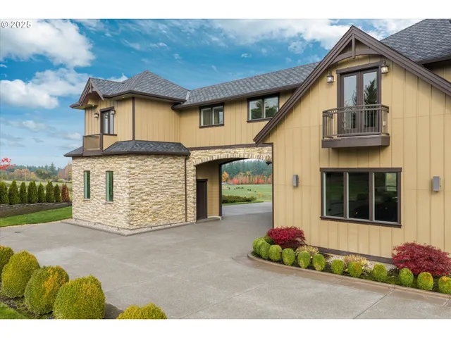 a front view of a house with a garden