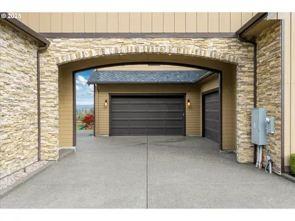 a front view of a house with garage