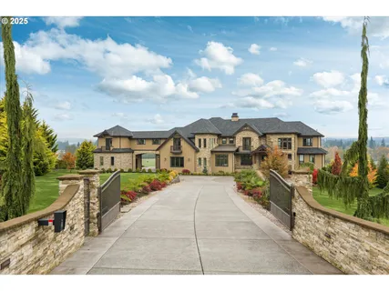a view of a house with wooden fence