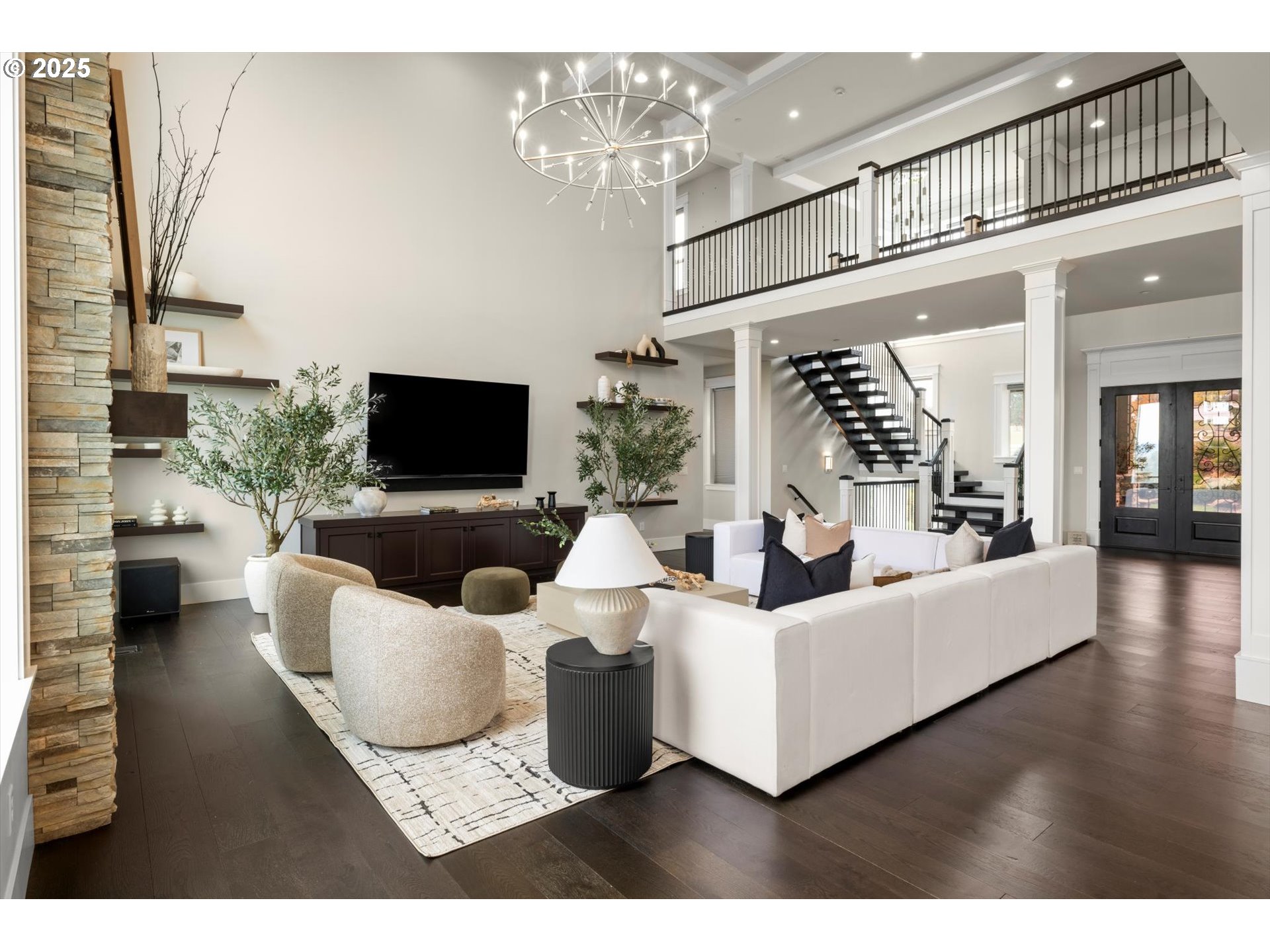 900 Northwest 216th Circle Ridgefield, WA 98642 - Photo 7 of 47 a living room with furniture a flat screen tv and a fireplace