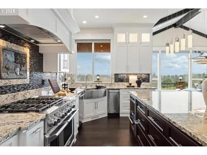 a kitchen with a stove a sink and a refrigerator