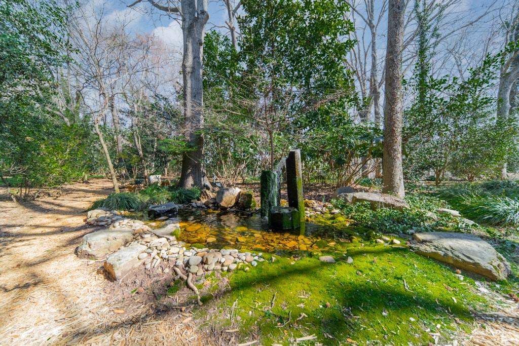 9331 Providence Road Charlotte, NC 28270 - Photo 11 of 39 a backyard of a house with lots of green space