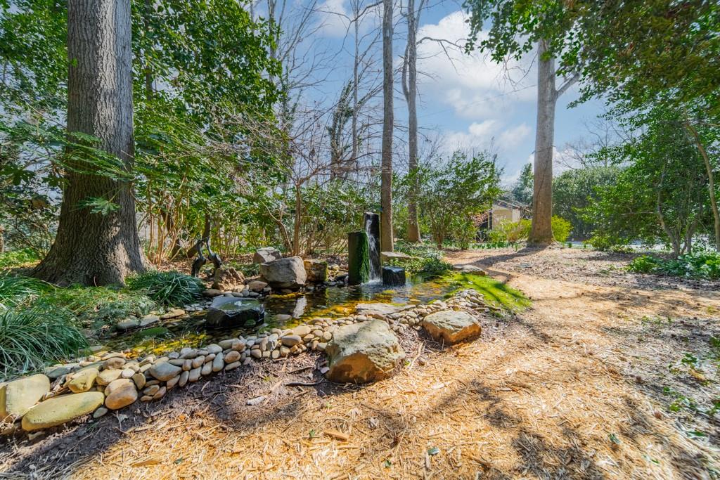 9331 Providence Road Charlotte, NC 28270 - Photo 12 of 39 a backyard of a house with lots of green space