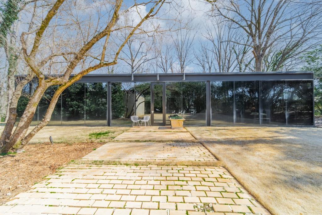9331 Providence Road Charlotte, NC 28270 - Photo 14 of 39 a view of a house with a yard and sitting area
