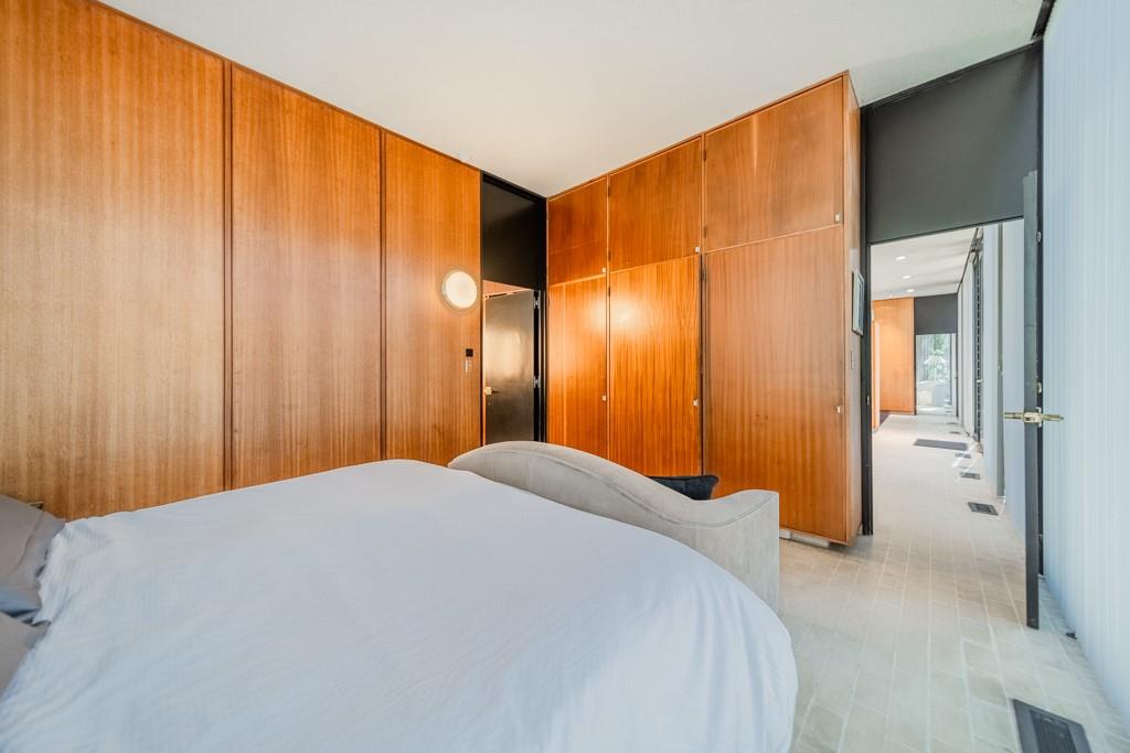 9331 Providence Road Charlotte, NC 28270 - Photo 23 of 39 a bedroom with a bed and a cabinet