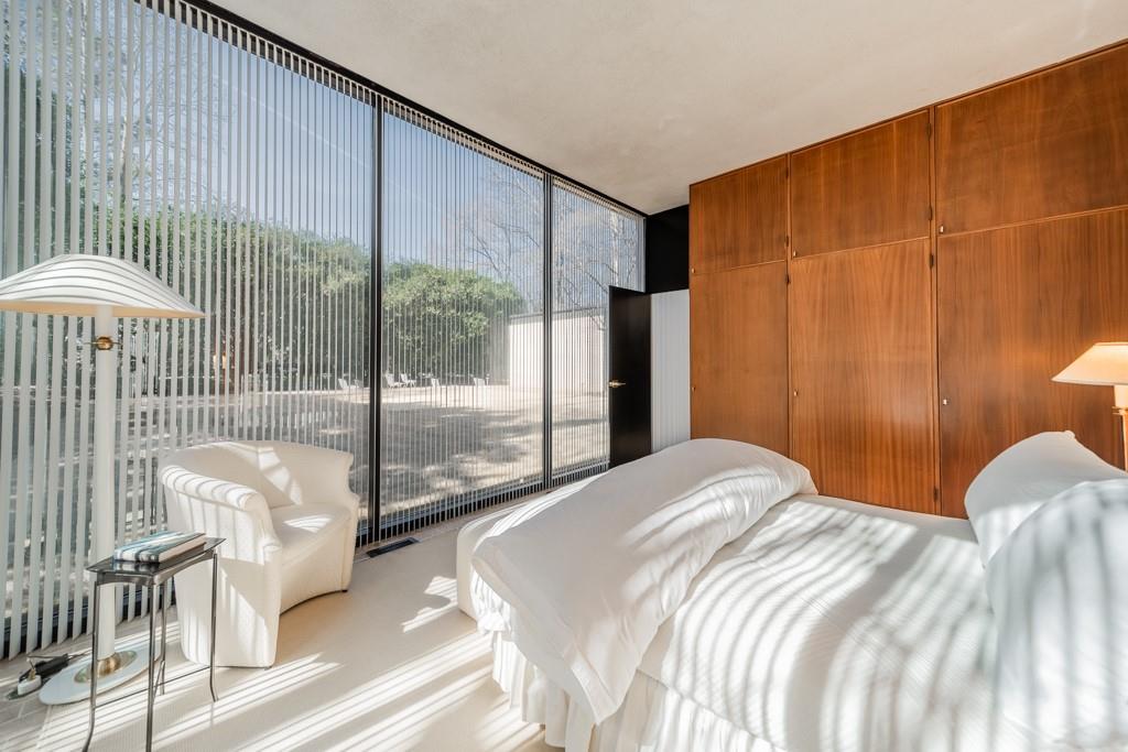 9331 Providence Road Charlotte, NC 28270 - Photo 27 of 39 a bedroom with a bed and glass door