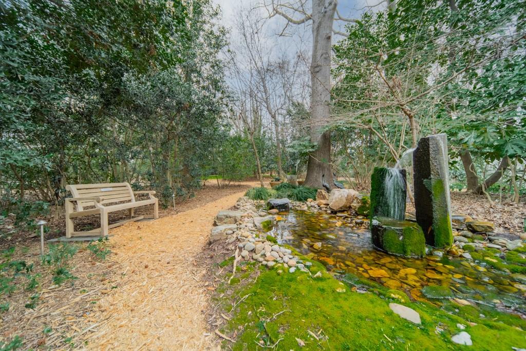9331 Providence Road Charlotte, NC 28270 - Photo 32 of 39 a view of a backyard with chairs