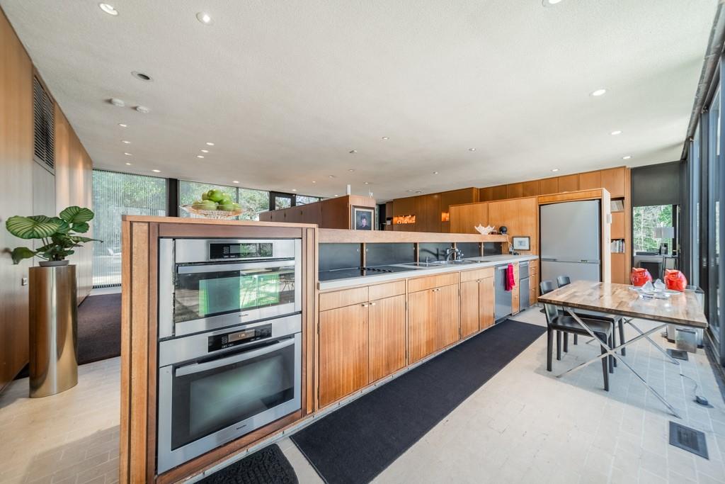 9331 Providence Road Charlotte, NC 28270 - Photo 4 of 39 a kitchen with stainless steel appliances a stove a sink and a refrigerator