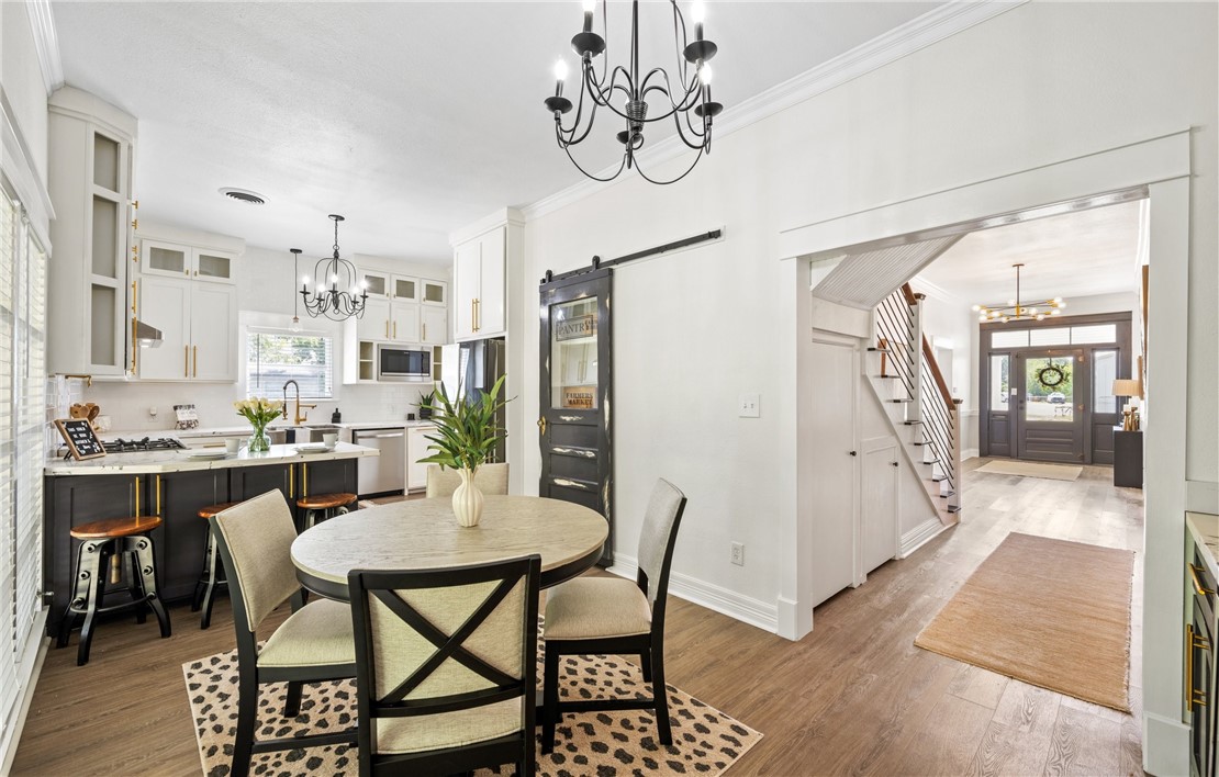 514 West 4th Street Sinton, TX 78387 - Photo 11 of 32 a view of a dining room with furniture window and wooden floor