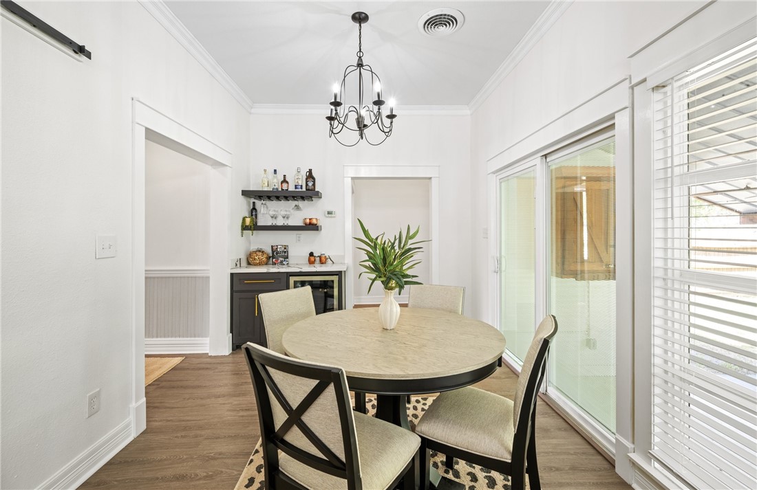 514 West 4th Street Sinton, TX 78387 - Photo 12 of 32 a view of a dining room with furniture window and wooden floor