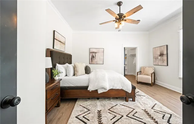 a bedroom with bed and window