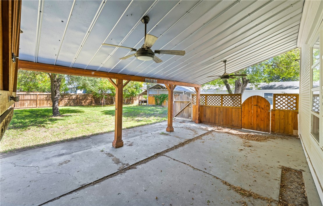 514 West 4th Street Sinton, TX 78387 - Photo 23 of 32 a view of a house with a porch and a yard