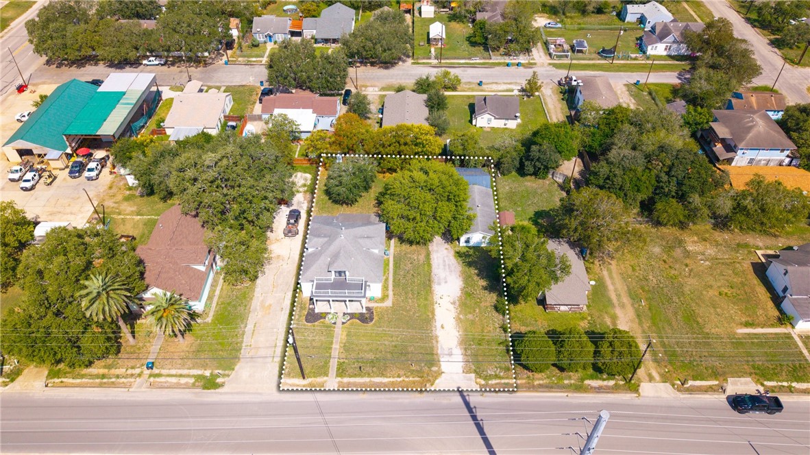 514 West 4th Street Sinton, TX 78387 - Photo 28 of 32 an aerial view of residential houses with outdoor space