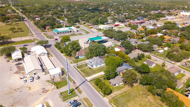 an aerial view of residential building and lake