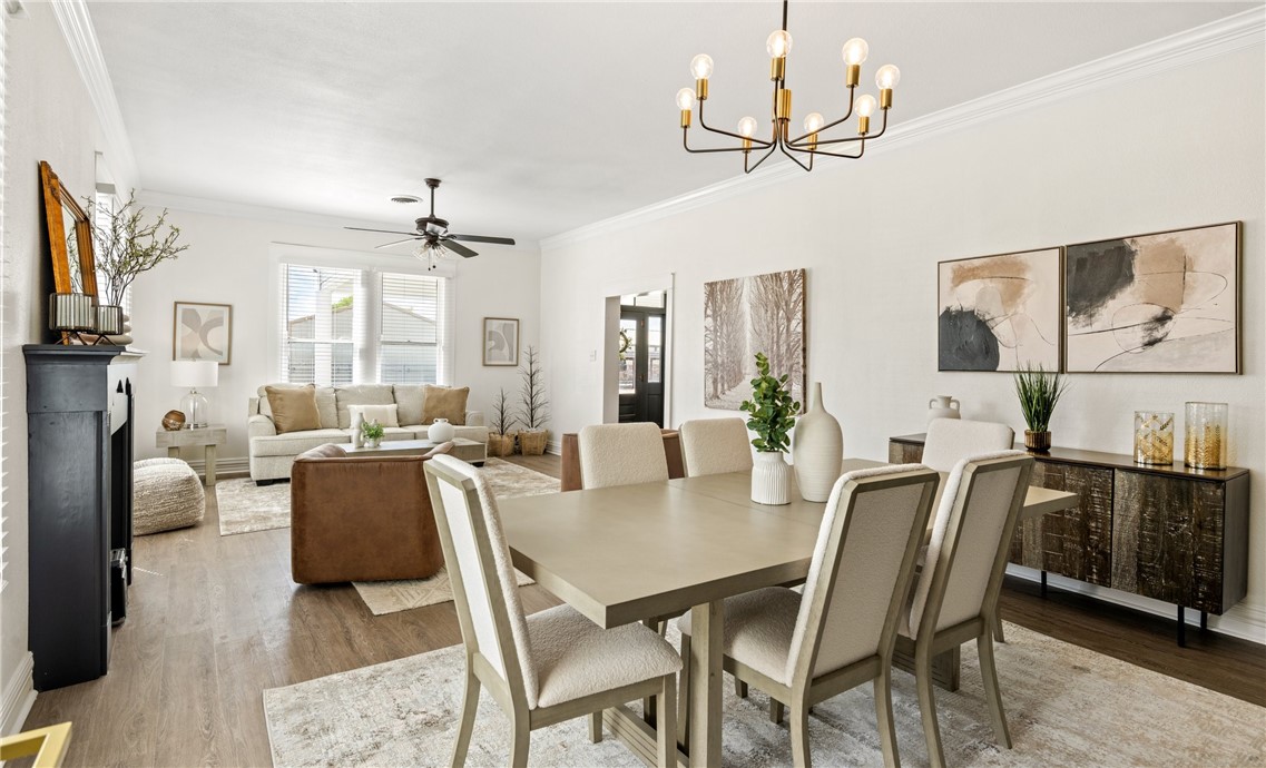 514 West 4th Street Sinton, TX 78387 - Photo 6 of 32 a view of a dining room with furniture and a chandelier
