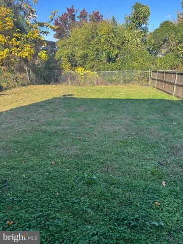 a view of a large yard with a large mountain