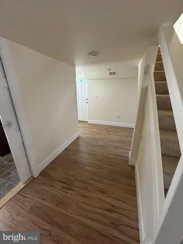 a view of a hallway with staircase