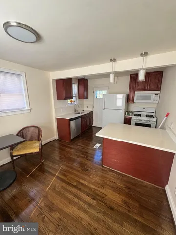 a living room with furniture and flat screen tv