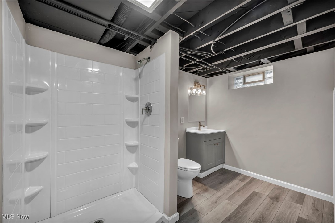 1560 Douglas Road Wickliffe, OH 44092 - Photo 29 of 39 Full bath with wood finished floors, vanity, and a stall shower