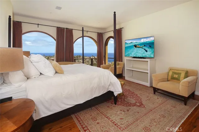 a bedroom with a bed couch and window