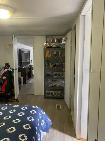 a bedroom with a bed and a walk in closet