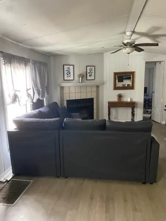a living room with furniture and a window