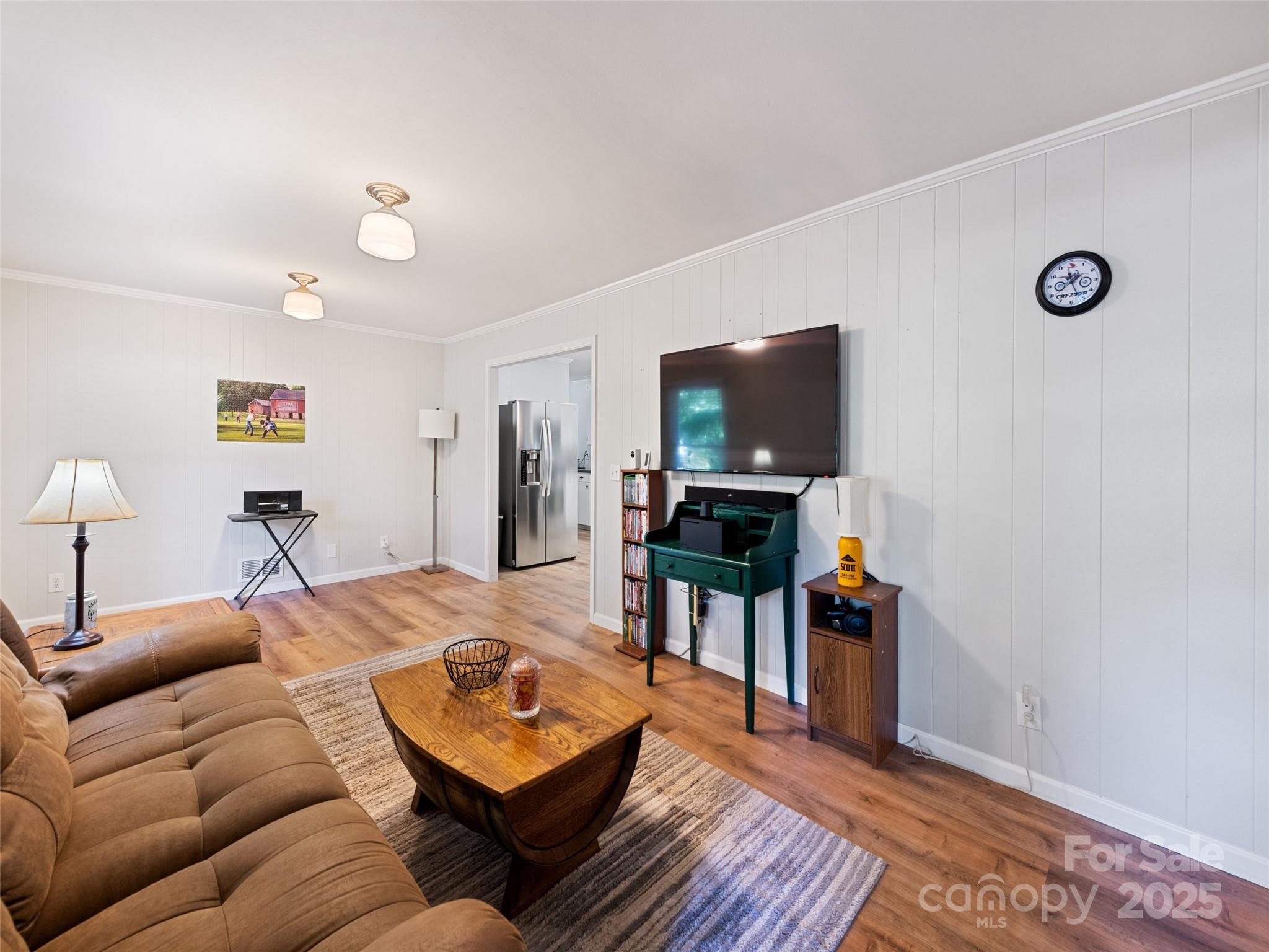 263 Blanton Street Columbus, NC 28722 - Photo 13 of 45 a living room with furniture and a flat screen tv