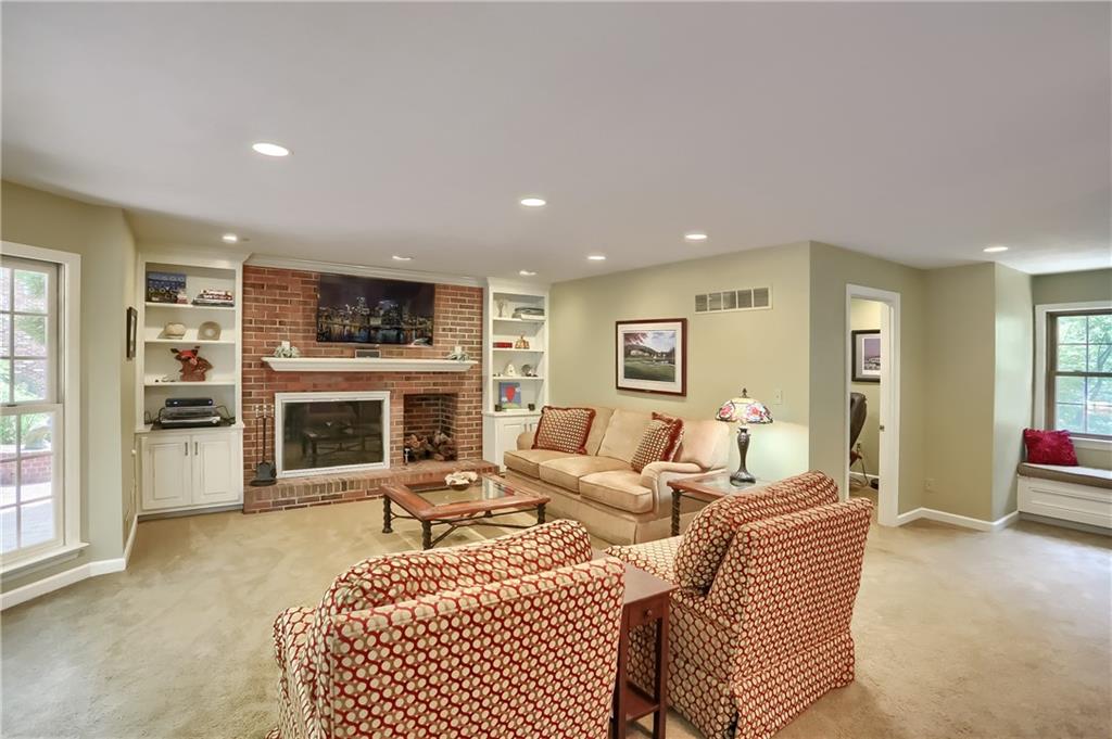 119 Berwyn Road Pittsburgh, PA 15237 - Photo 12 of 25 a living room with furniture a fireplace and a flat screen tv