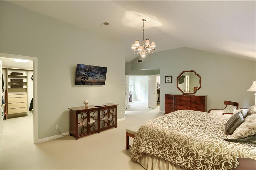119 Berwyn Road Pittsburgh, PA 15237 - Photo 16 of 25 a bedroom with a large bed and a chandelier