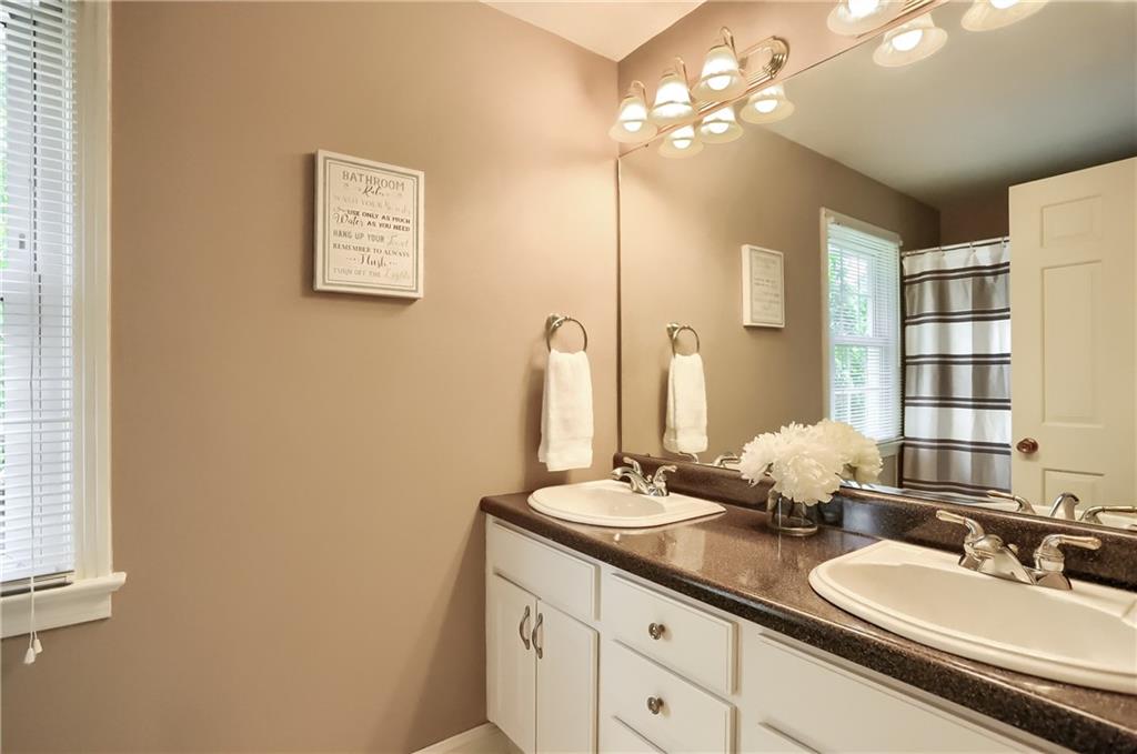 119 Berwyn Road Pittsburgh, PA 15237 - Photo 23 of 25 a bathroom with a double vanity sink and a mirror