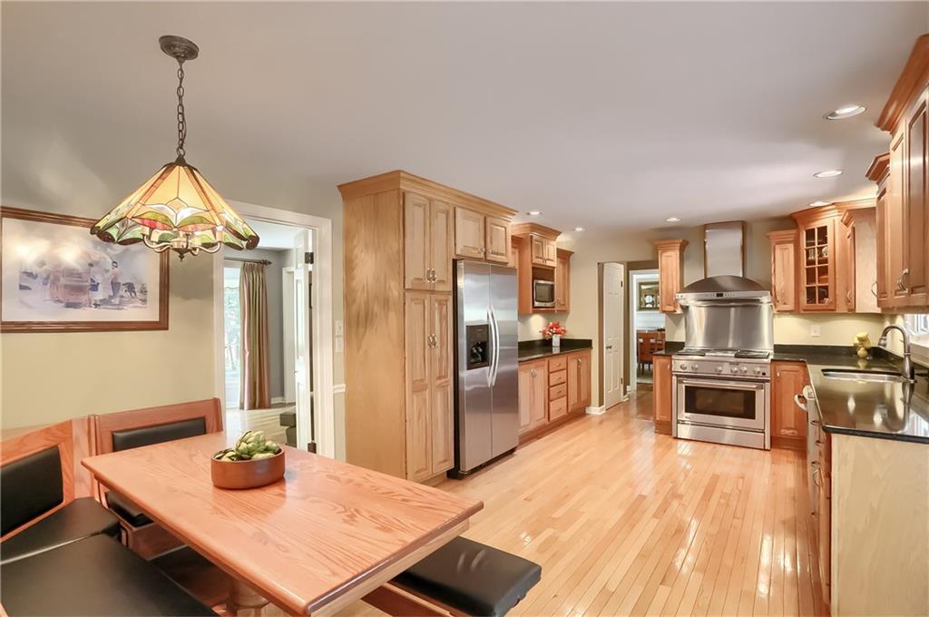 119 Berwyn Road Pittsburgh, PA 15237 - Photo 9 of 25 a living room with stainless steel appliances furniture stove and kitchen view