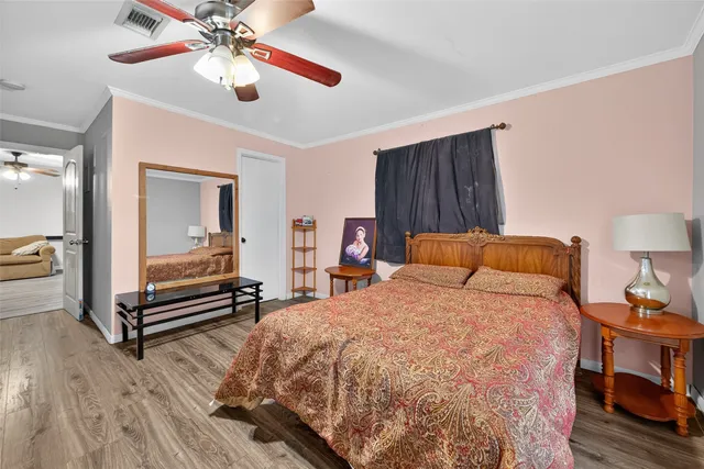 a bed room with a bed and a chandelier