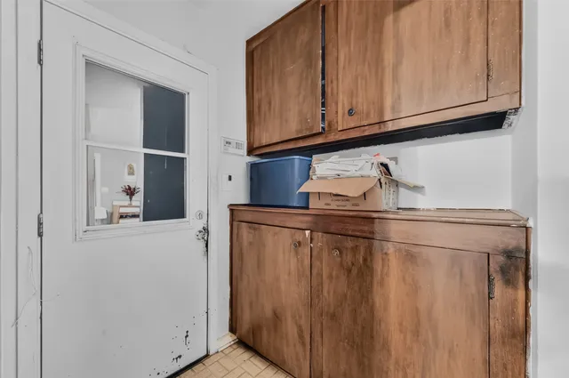 a kitchen with stainless steel appliances granite countertop a refrigerator and cabinets