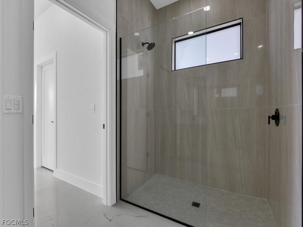 1839 Lockhaven Court Lehigh Acres, FL 33972 - Photo 13 of 23 a bathroom with a shower