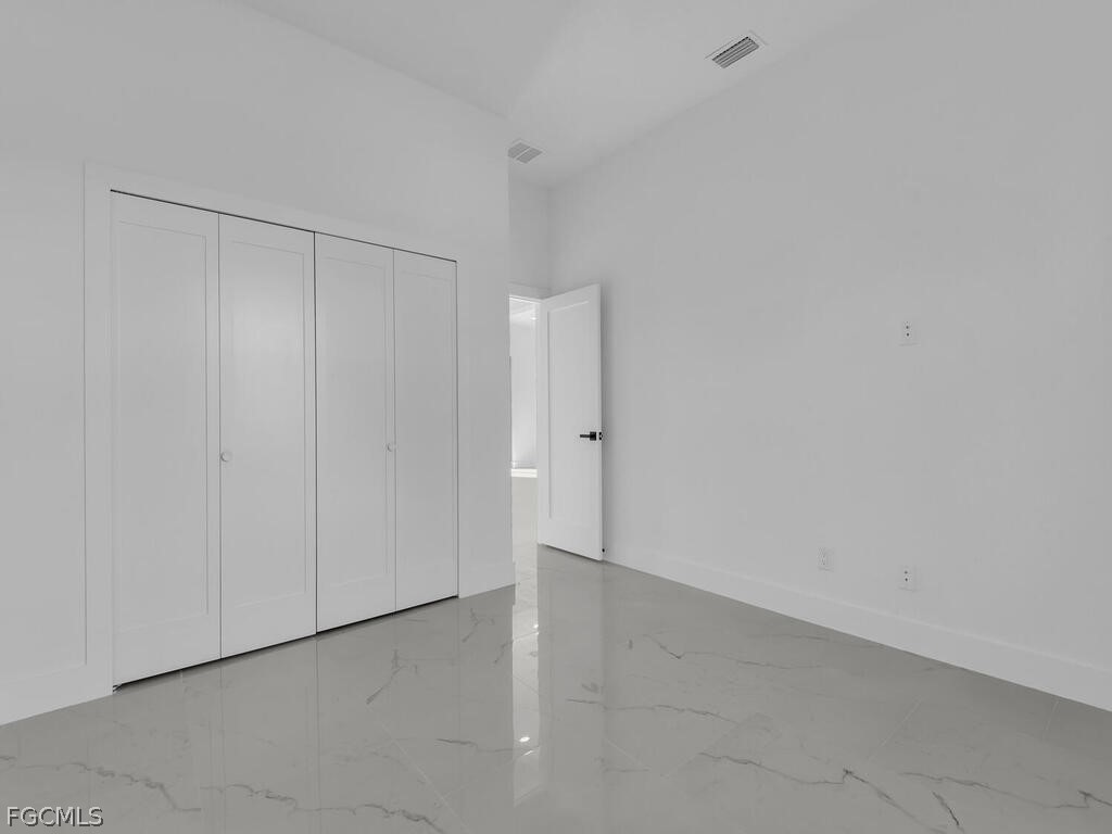 1839 Lockhaven Court Lehigh Acres, FL 33972 - Photo 16 of 23 a view of an empty room