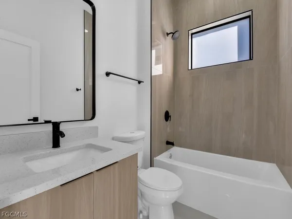 a bathroom with a sink a toilet and a bathtub