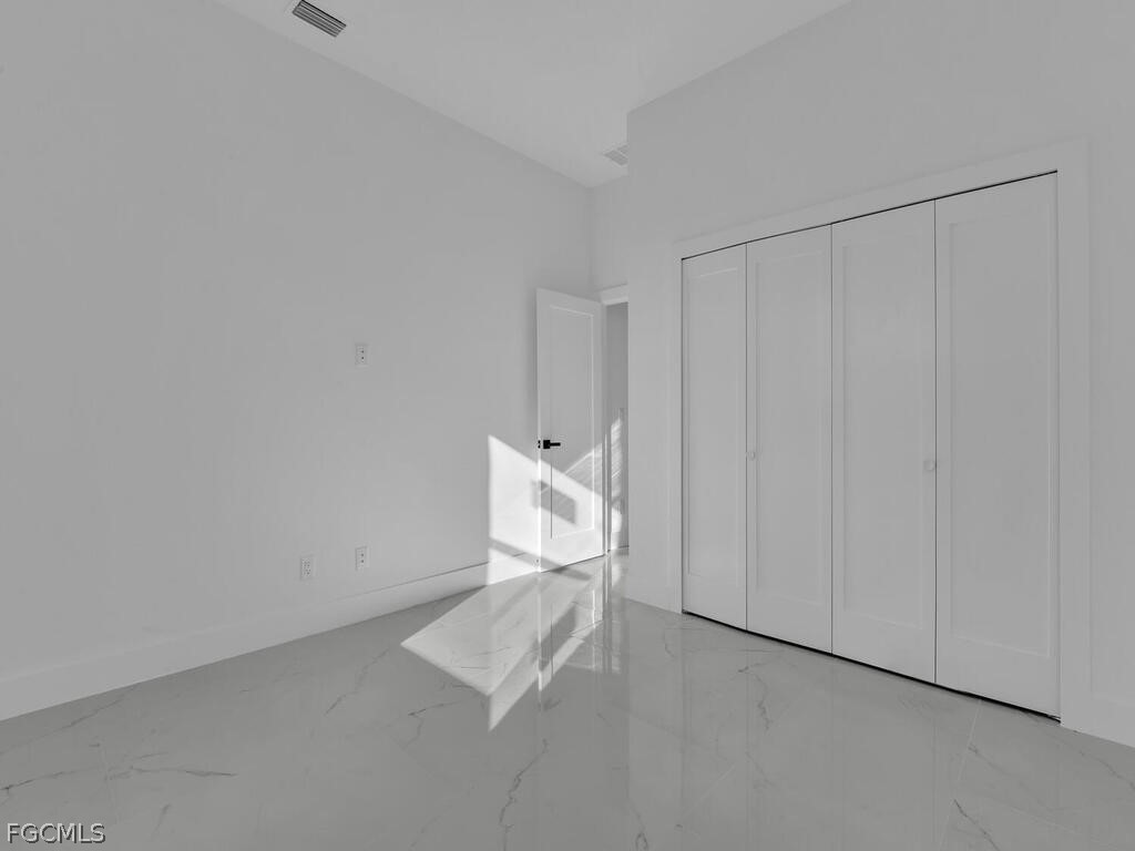 1839 Lockhaven Court Lehigh Acres, FL 33972 - Photo 19 of 23 a bathroom with a shower