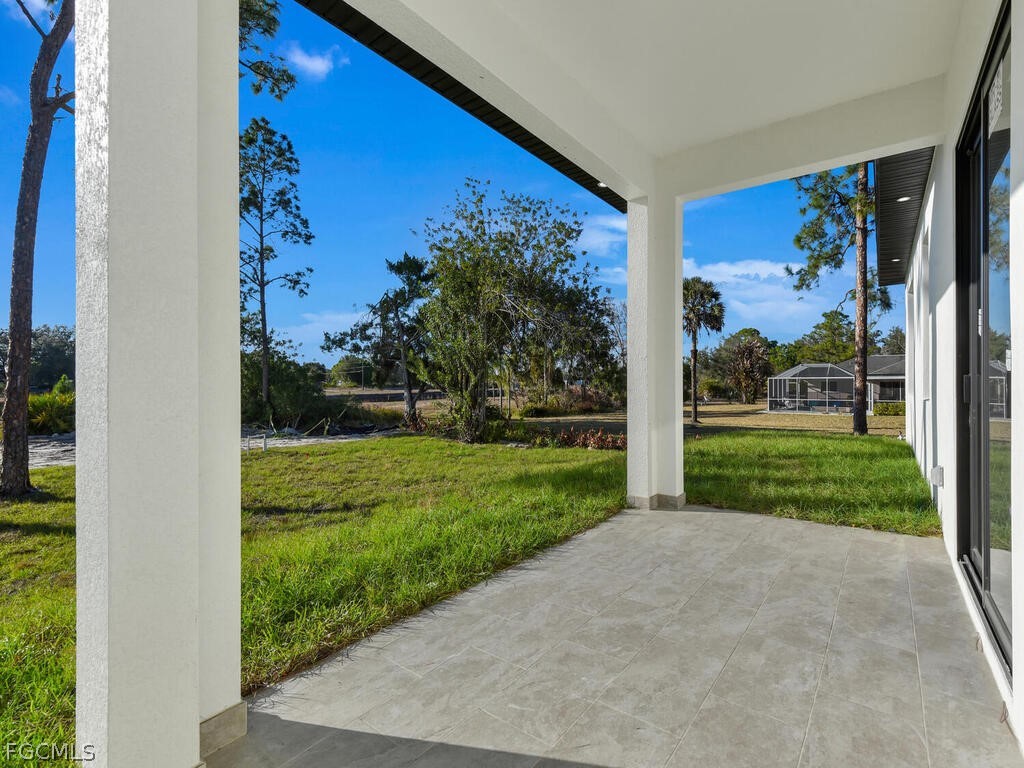 1839 Lockhaven Court Lehigh Acres, FL 33972 - Photo 22 of 23 a view of a backyard with garden