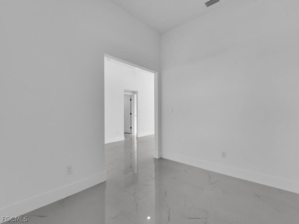 1839 Lockhaven Court Lehigh Acres, FL 33972 - Photo 6 of 23 a view of an empty room