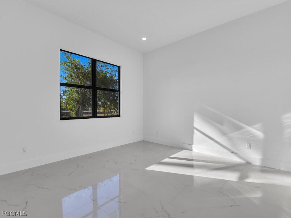 1839 Lockhaven Court Lehigh Acres, FL 33972 - Photo 10 of 23 an empty room with windows