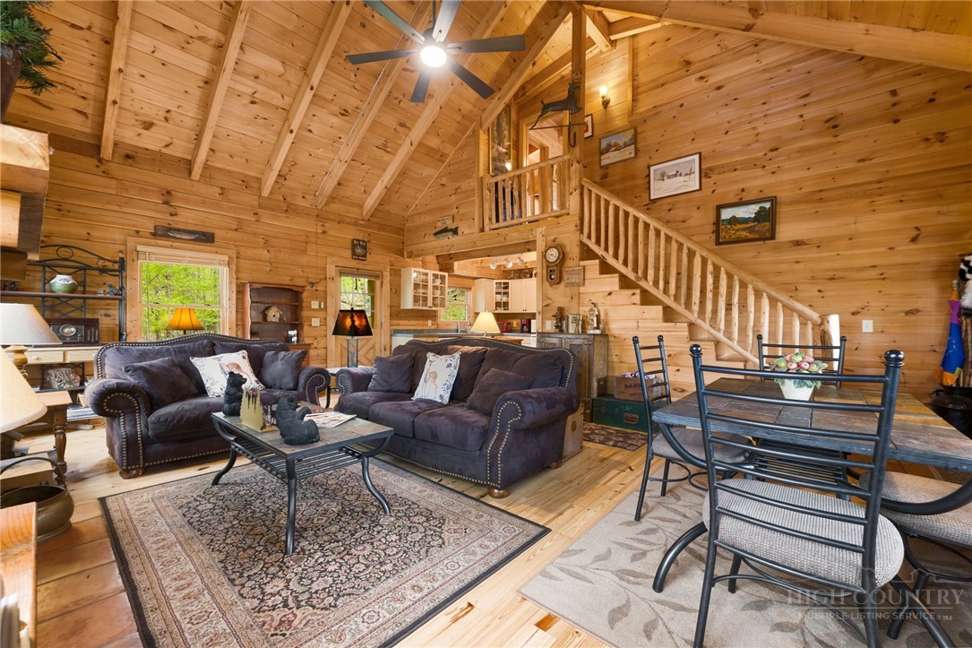 259 Greenbriar Road Beech Mountain, NC 28604 - Photo 11 of 41 a living room with lots of furniture and a rug
